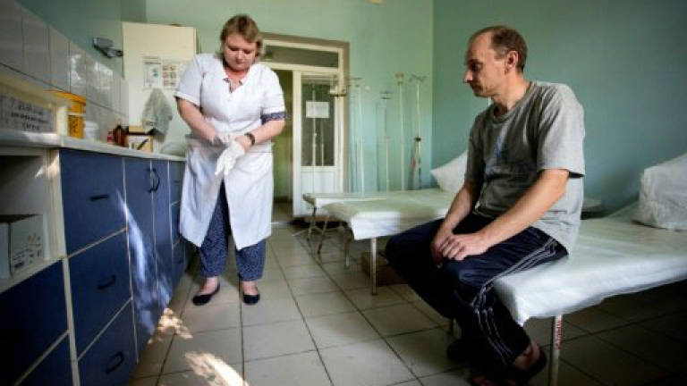 In rebel-held Ukraine, activists struggle to stem HIV spread