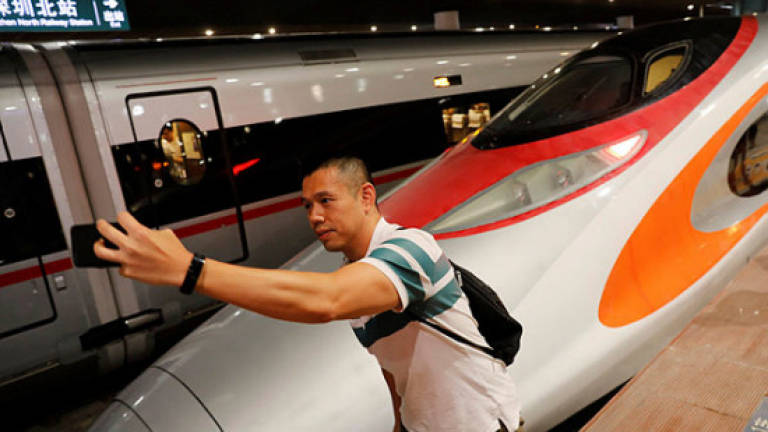Fear and fanfare as Hong Kong launches China rail link