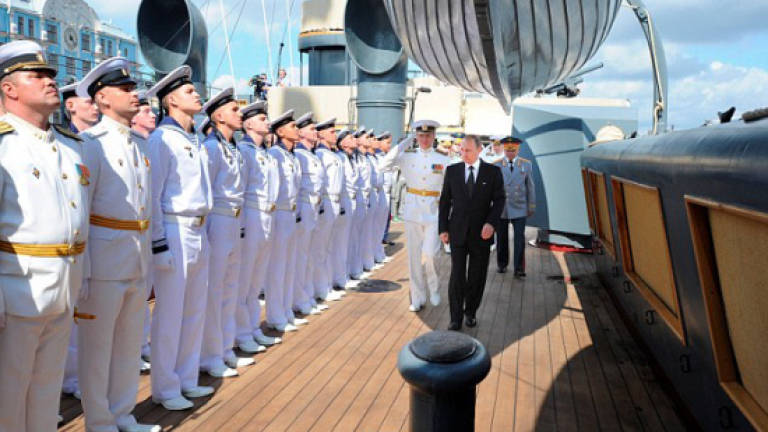 Putin shows off Russia's naval might with major parade