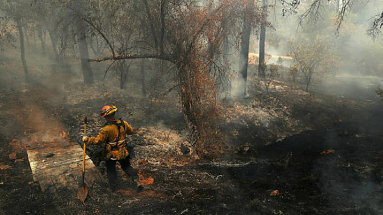 Death toll rises as dry conditions fuel deadly California fires