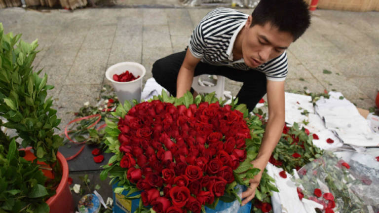 On Chinese Valentine's Day, businesses woo 'single dogs'