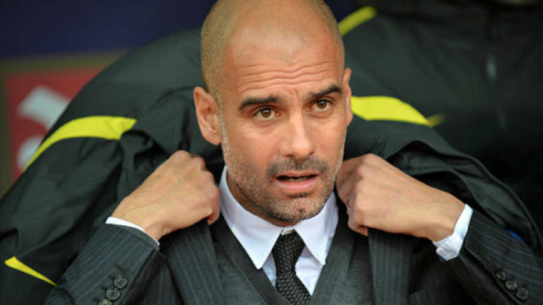 Guardiola hits back at Toure's racism jibes