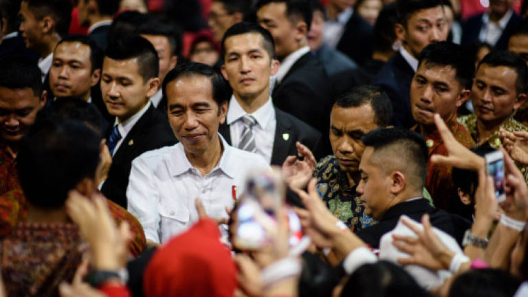 Celebration and protest as Indonesian leader visits Hong Kong