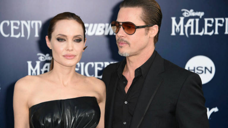 Jolie, Pitt agree to settle divorce in private