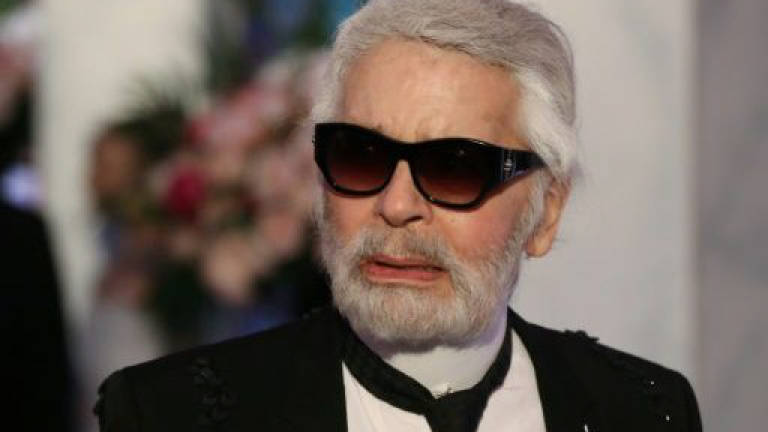 Lagerfeld may drop German citizenship over migrant welcome