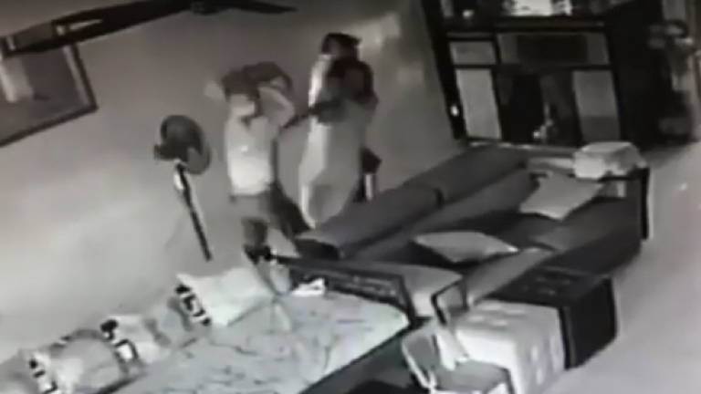 Robbers caught on CCTV bashing up victim