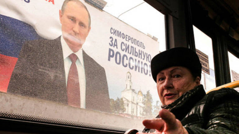 Putin says he will 'never' give Crimea back to Ukraine