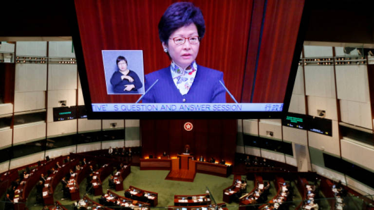 New HK leader strikes conciliatory tone