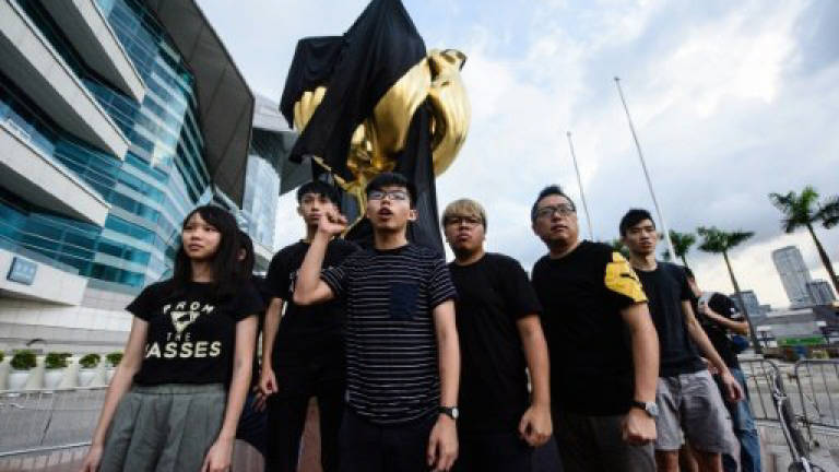 Hong Kong activists stage China protest ahead of Xi visit