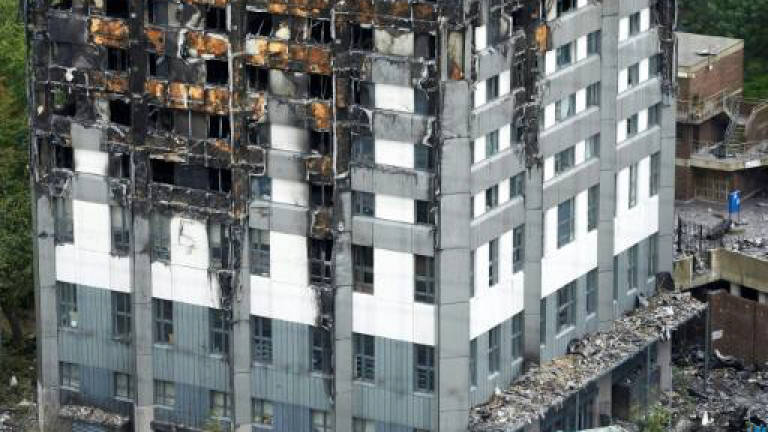 Five London towers evacuated over fire safety fears