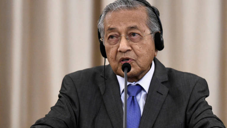Setting basis for country recovery may take at least two years: Dr M