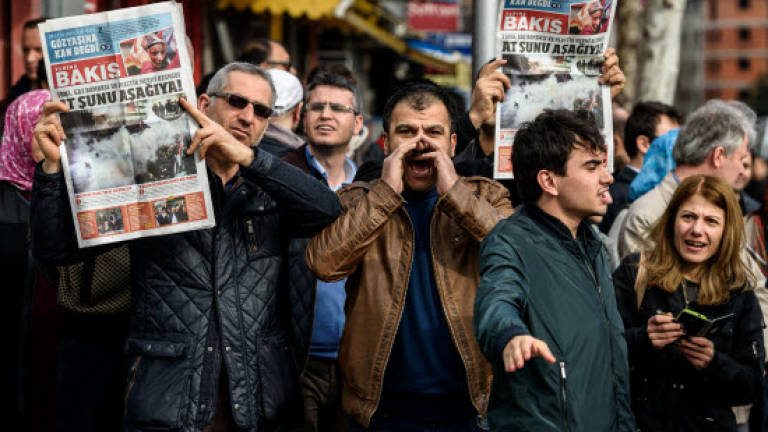 Seized anti-Erdogan paper toes Turkish government line