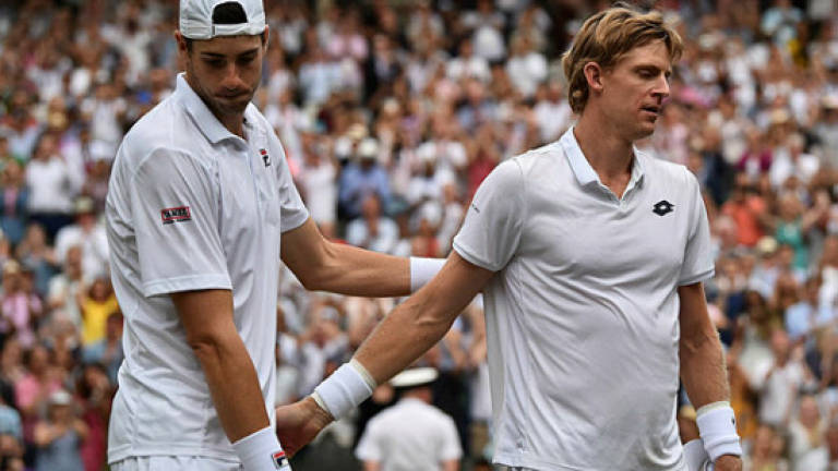 Anderson, Isner demand change after epic as Nadal and Djokovic halted