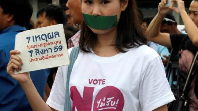 Thai police charge two eight-year-old girls who tore down pink lists