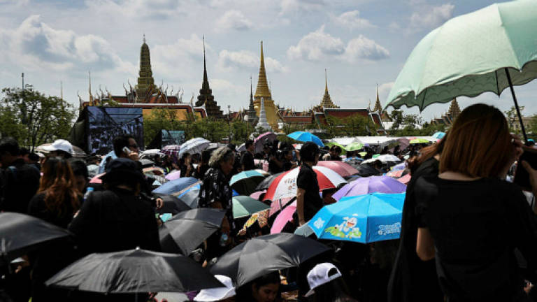 Massive crowds sing royal tribute to late Thai king