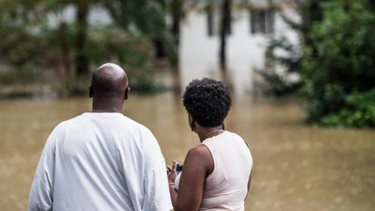 Record-setting rains submerge parts of US Southeast