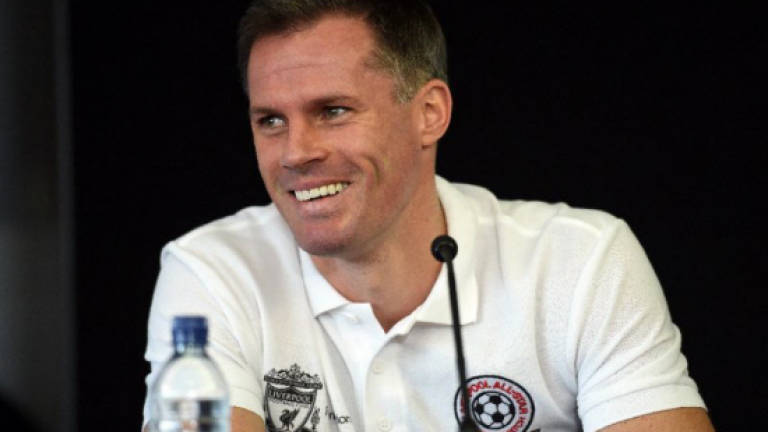 TV pundit Carragher blames 'moment of madness' for spitting incident