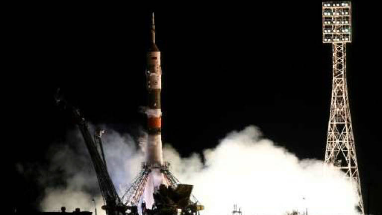 Two astronauts, cosmonaut return from five-month ISS mission