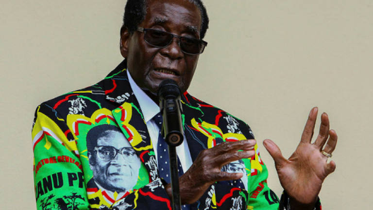 Supporters gather for Mugabe's lavish birthday party