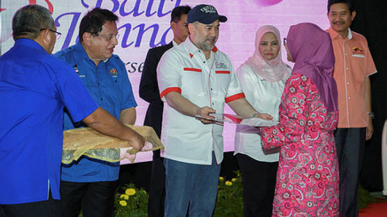 Agong hands over keys to 12 recipients of PPR, PA housing units