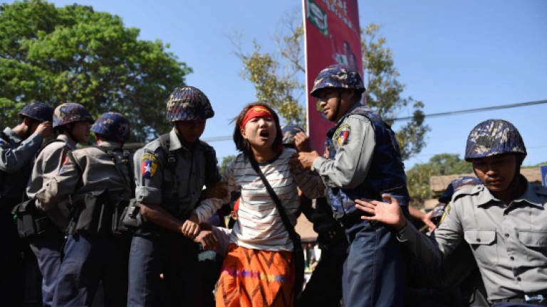 Myanmar defends rally crackdown, police arrest more protesters