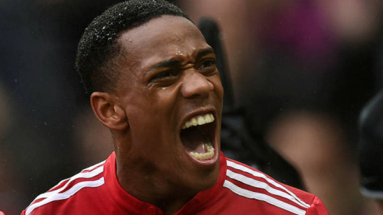 Supersub Martial stars as United down Spurs