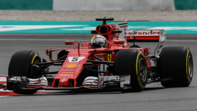 Flying Vettel puts pressure on Hamilton