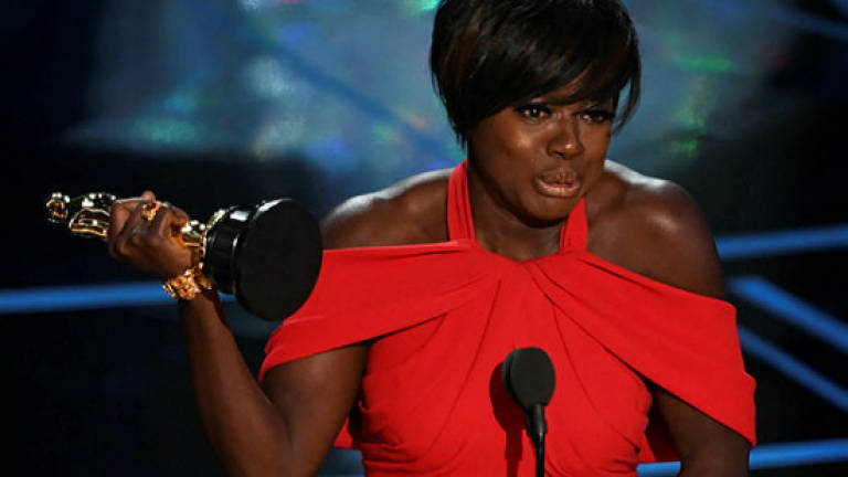Black actors triumph at very political Oscars