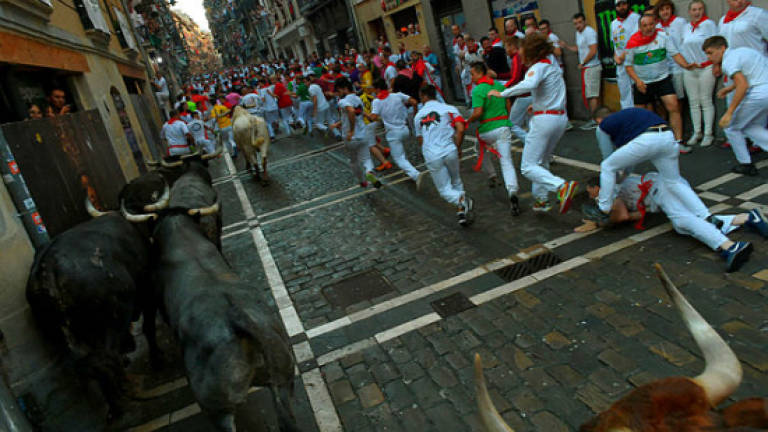 Famed Spanish bull run ends with two gored, dozens hurt