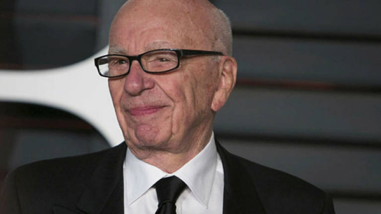 News Corp reports loss on writedowns, weakness in newspapers