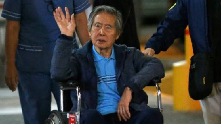 Peru court orders Fujimori tried for 1992 mass killing