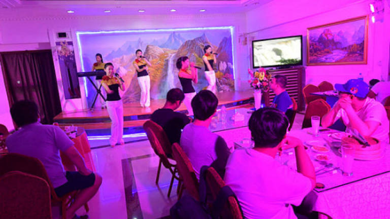 North Korean rockettes serve up Coca-Cola in Dubai North Korean rockettes serve up Coca-Cola in Dubai