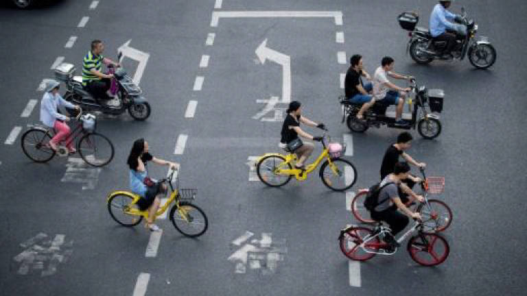 China starts regulating bike-sharing as complaints soar