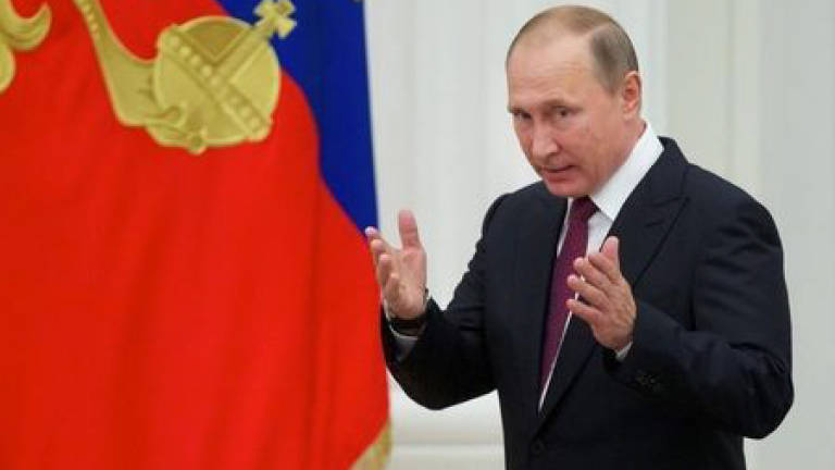 Putin calls to boost Russia's defences