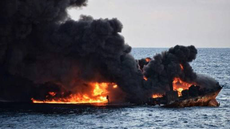'Oil-like' blobs hit Japan beaches after tanker sinks