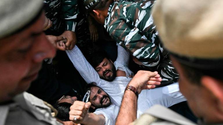 Policemen detain Aam Aadmi Party (AAP) activists during a protest near India’s Prime Minister Narendra Modi residence in New Delhi on March 26, 2024, after AAP chief and Delhi Chief Minister Arvind Kejriwal arrest in connection with a long-running corruption probe/AFPPix