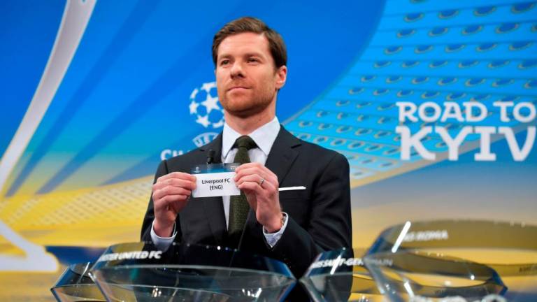 Filepix: Spanish former international Xabi Alonso shows the slip of Liverpool FC during the draw for the round of 16 of the UEFA Champions League football tournament at the UEFA headquarters in Nyon on December 11, 2017/AFPPix