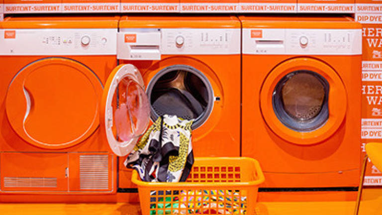 Hermès' luxe silk scarf laundromat hits new destinations Hermès' luxe silk scarf laundromat hits new destinations