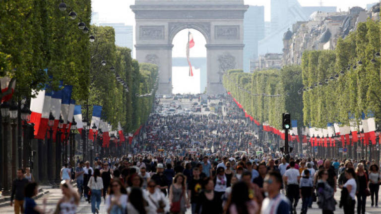 Strolling and selfies as Paris' Champs-Elysees goes car-free