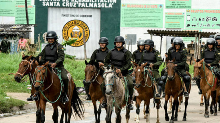 Seven inmates killed in Bolivia as police storm prison