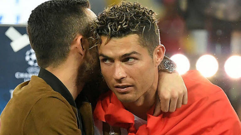 Ronaldo's future casts cloud over Real's historic treble
