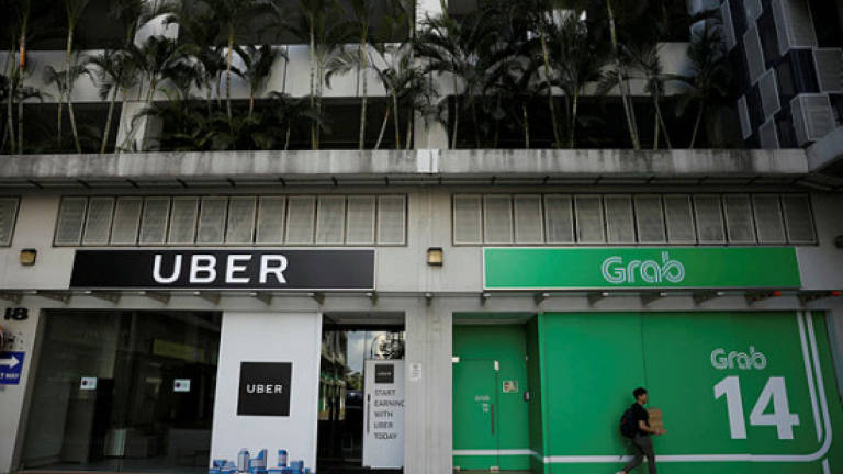 Singapore fines Grab &amp; Uber S$13m for merger that harms competition