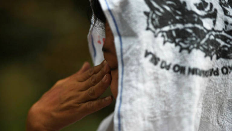 Enduring pain for Philippine drug war widows