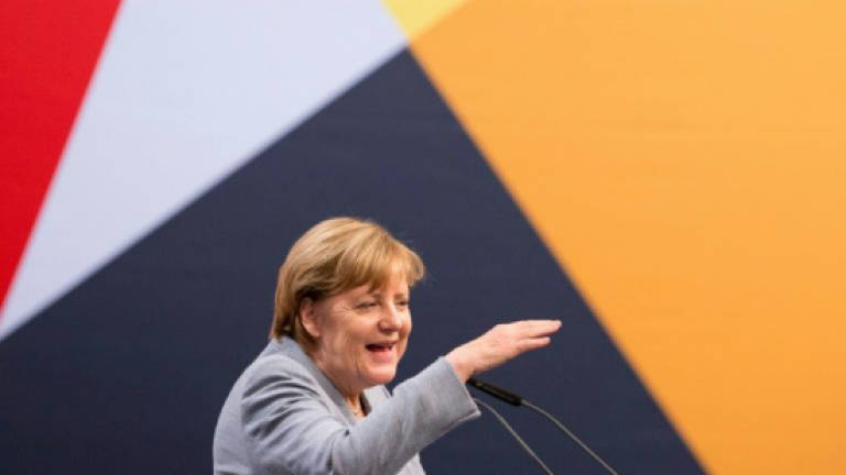 Merkel back at the polls before tough coalition talks