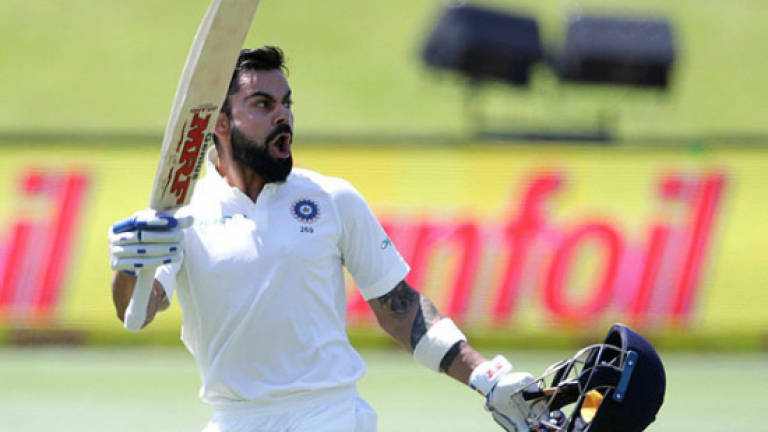 Kohli century keeps India in touch with South Africa