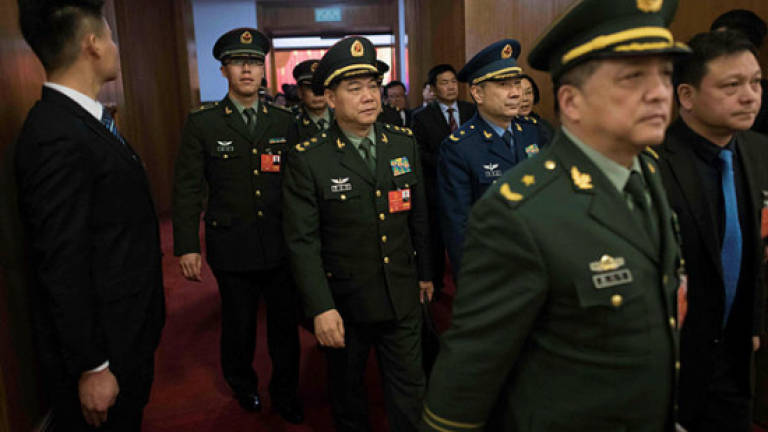 China's Xi calls for military loyalty to new constitution