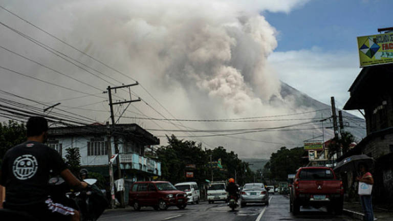 Volcano rains ash on Philippines as experts warn of violent eruption