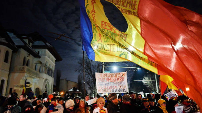 Thousands of Romanians march against government