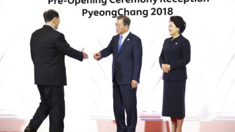 North and South Korea heads of state meet, shake hands
