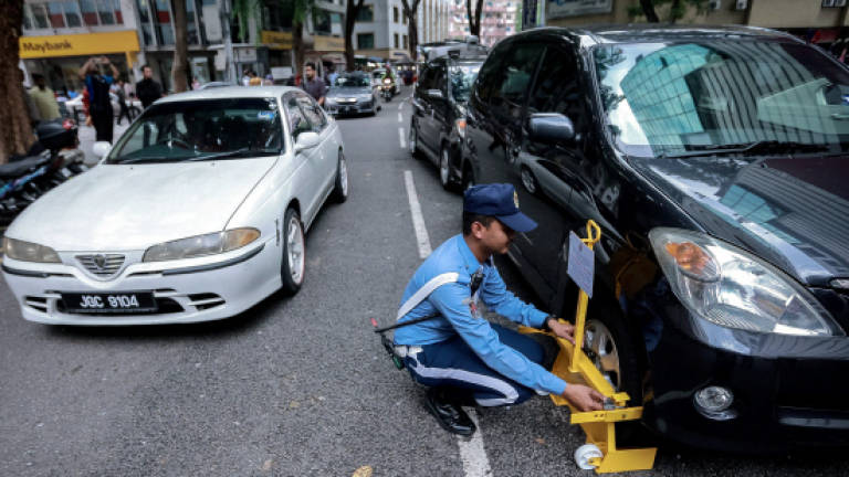Clamps only for those parking without paying: DBKL